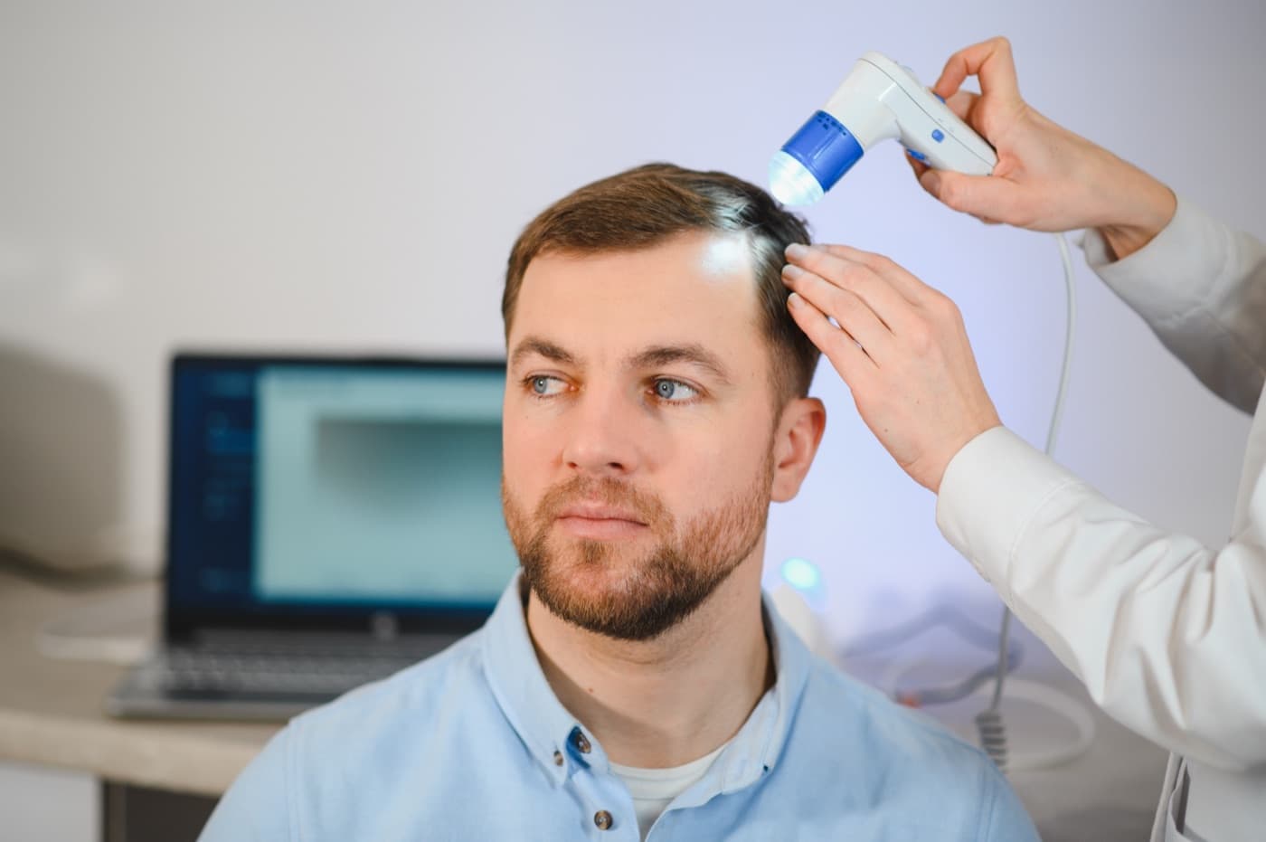 Clinician using an imaging device for a hair scan